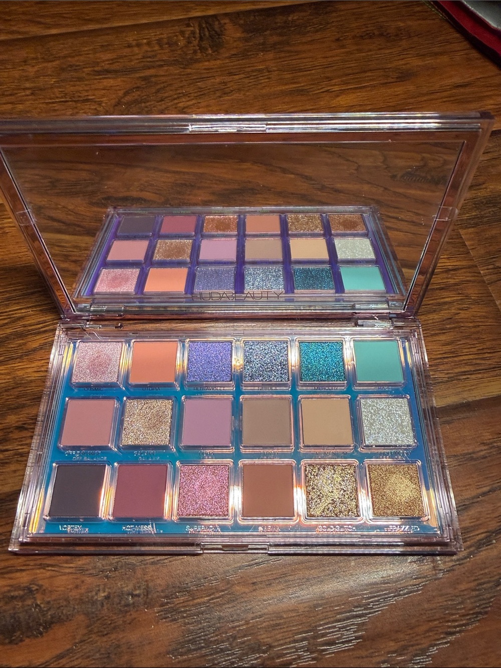 HUDA BEAUTY Eyeshadow Palette — Pink, Purple, Teal, Peach & Gold Shades. gently